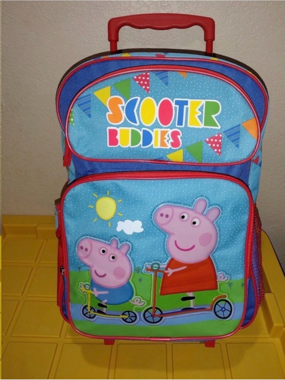 Vintage Y2K blue Peppa Pig "Scooter Buddies" rolling backpack.
